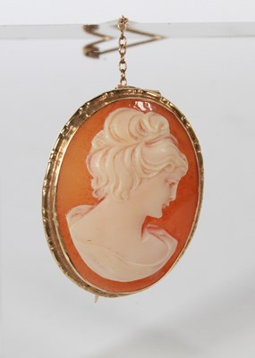 Lot 74 - A 9 carat yellow gold carved shell portrait...
