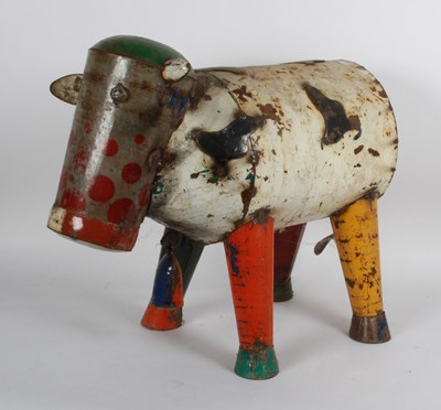 Lot 932 - A recycled tin model of a cow, 61cm