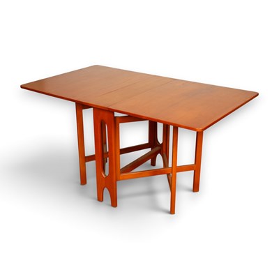 Lot 390 - A mid century teak drop leaf extending dining...