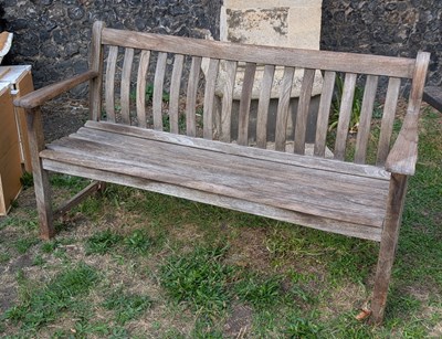 Lot 807 - A teak slatted garden bench