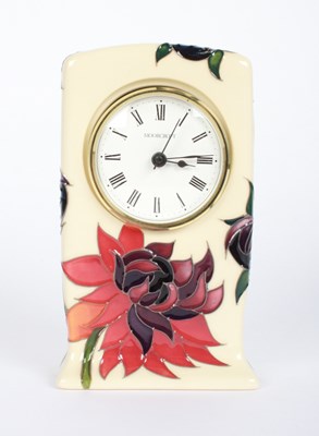 Lot 406 - A Moorcroft Ruby Red pattern clock, 15 x 9cm