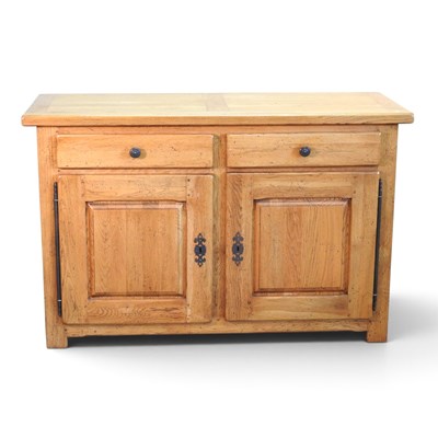 Lot 545 - A large modern light oak sideboard, containing...