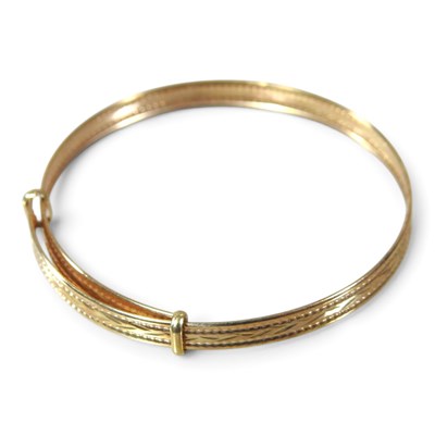 Lot 184 - A Victorian gold christening bangle, with...