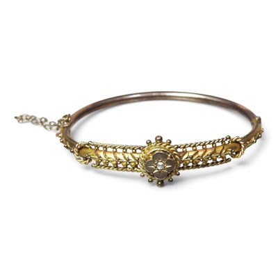 Lot 5 - An antique 9 carat gold and seed pearl bangle,...