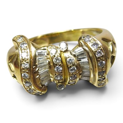 Lot 155 - An 18 carat gold and diamond fancy set ring,...