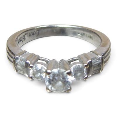 Lot 185 - A 14 carat white gold and diamond ring, the...