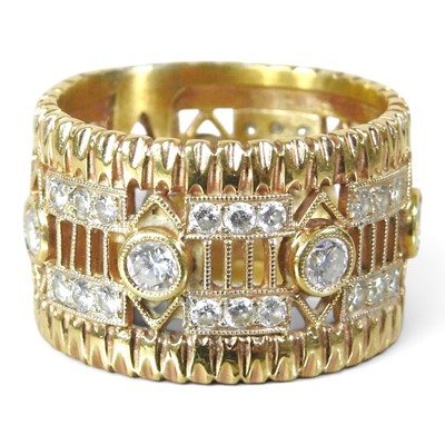 Lot 99 - A gold and diamond band ring, of openwork...