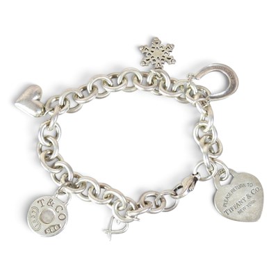 Lot 119 - A Tiffany & Co. silver bracelet, suspended...