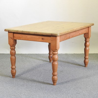 Lot 408 - A pine dining table