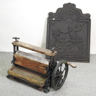 Lot 409 - A cast iron fire back