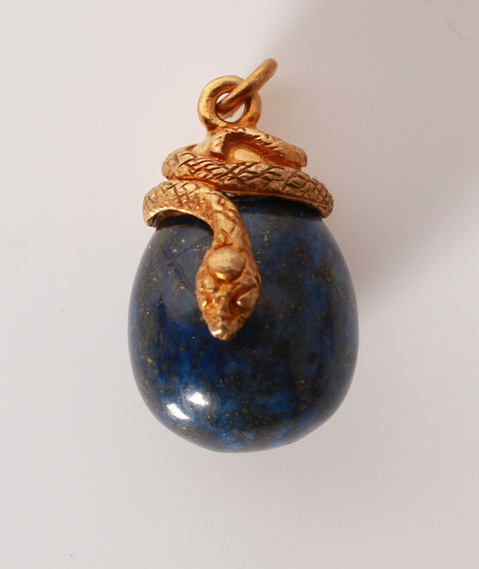 Lot 113 - A silver gilt lapis lazuli snake and egg