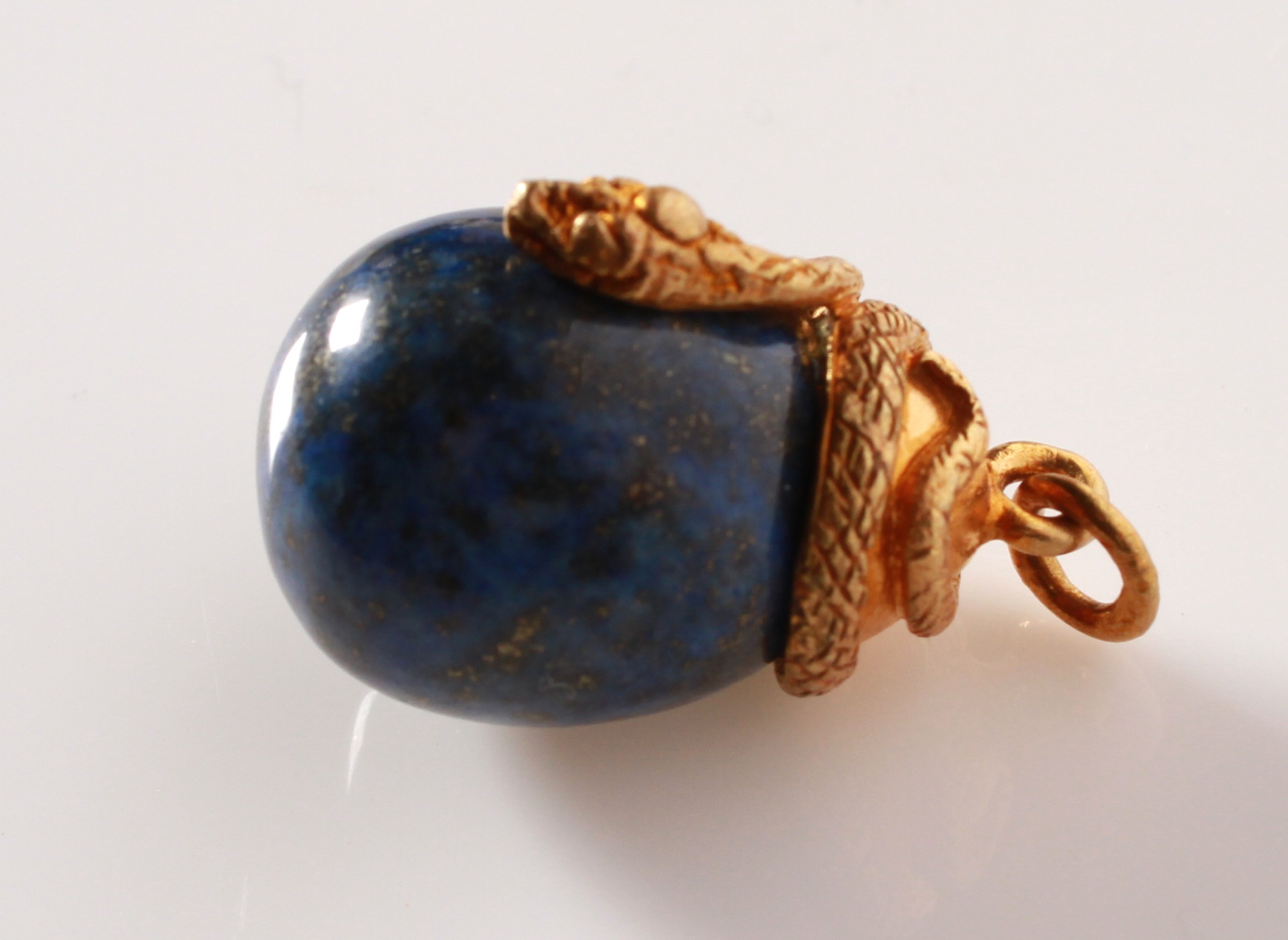 Lot 113 - A silver gilt lapis lazuli snake and egg