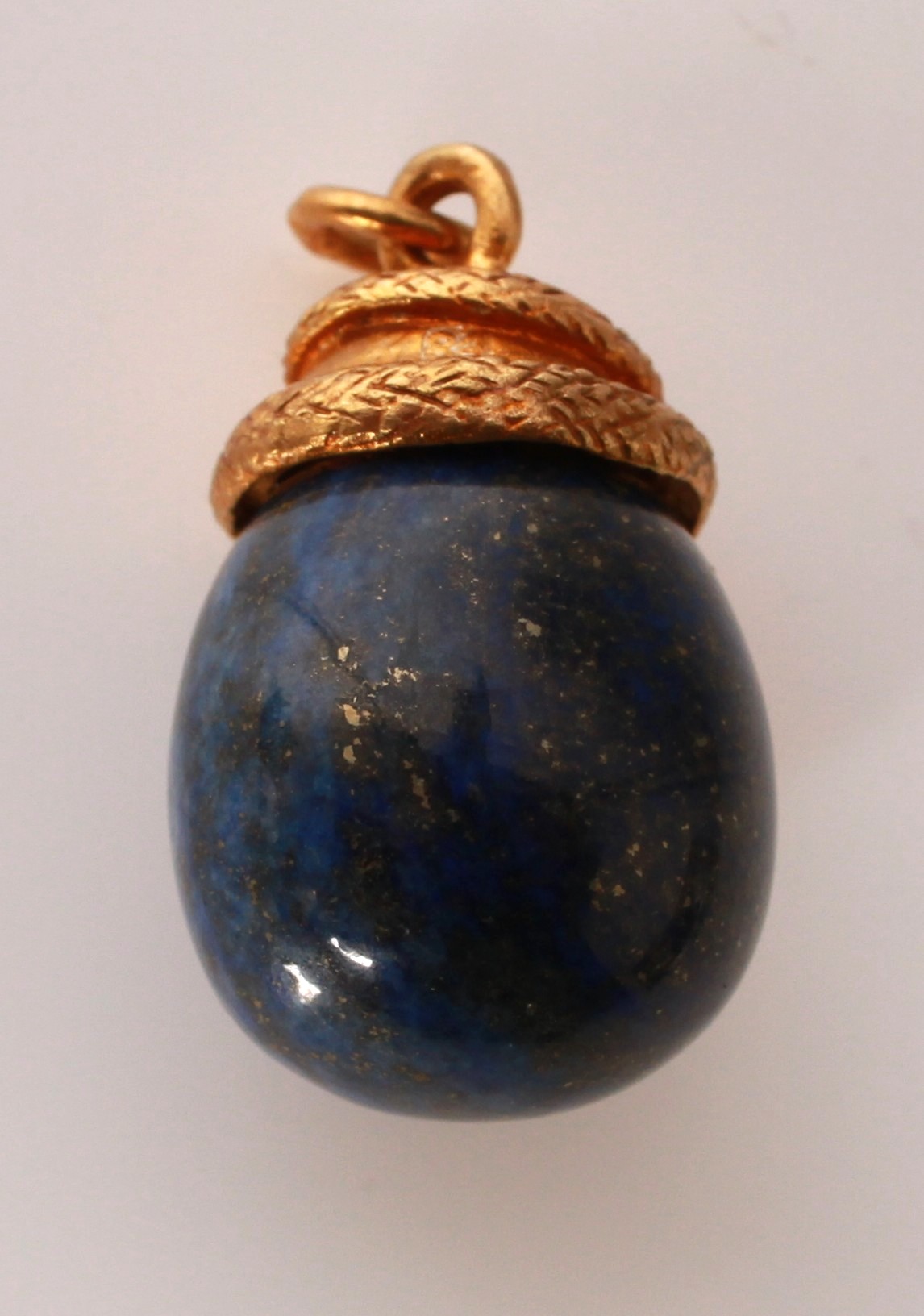 Lot 113 - A silver gilt lapis lazuli snake and egg