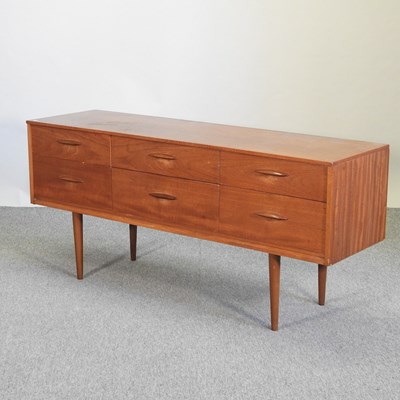 Lot 657 - A 1960's teak effect dressing chest