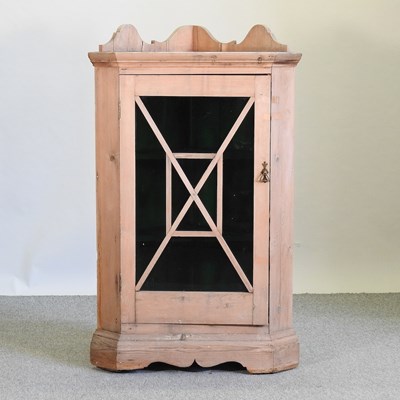 Lot 413 - A pine astragal glazed hanging corner cabinet