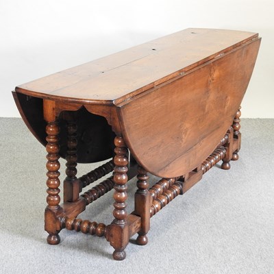 Lot 525 - An 18th century style oak wakes table