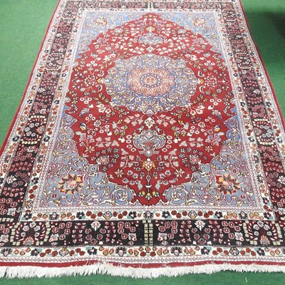 Lot 555 - A large Persian carpet