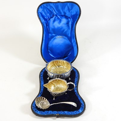 Lot 2 - A Victorian silver and gilt cream set