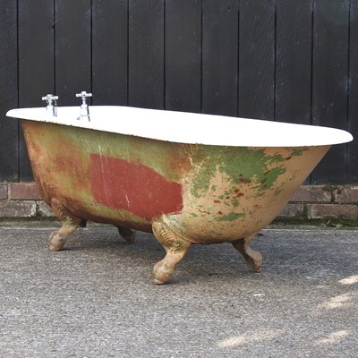 Lot 331 - A cast iron roll top bath