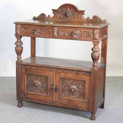 Lot 572 - A Victorian carved oak buffet