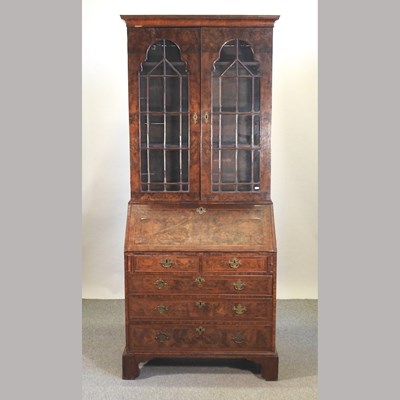Lot 439 - A George III style burr walnut bureau bookcase
