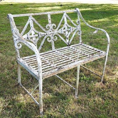 Lot 338 - A Regency style white painted cast iron garden bench