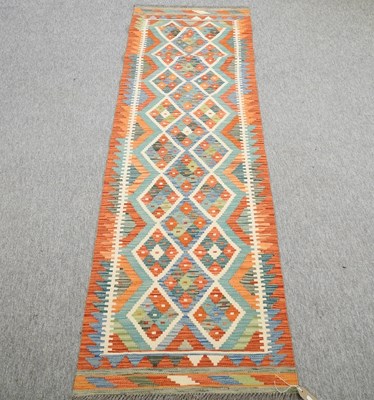 Lot 223 - A kelim runner