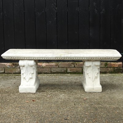 Lot 364 - A cast stone garden bench