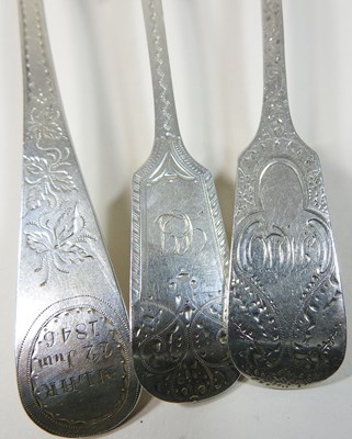 Lot 46 - A collection of George III bright cut silver table spoons