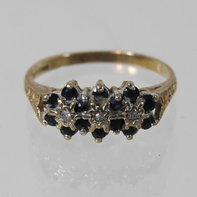 Lot 166 - A 9 carat gold sapphire and diamond triple cluster ring