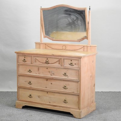 Lot 69 - An Edwardian stripped pine dressing chest