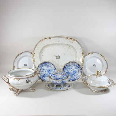 Lot 177 - A 19th century extensive white glazed part dinner service, each piece bearing a family crest