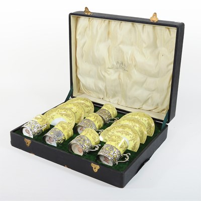 Lot 14 - An Edwardian silver mounted yellow glazed porcelain coffee set