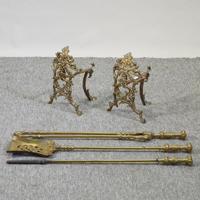 Lot 72 - A pair of ornate 19th century brass fire dogs