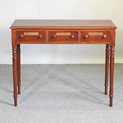 Lot 525 - A mahogany chemist's table