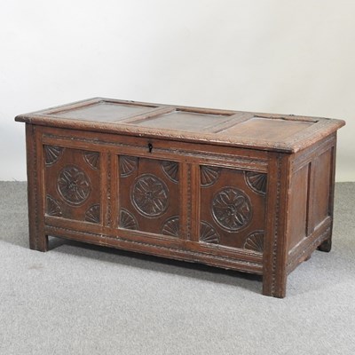 Lot 637 - An 18th century carved oak coffer