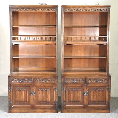 Lot 450 - A pair of Old Charm style oak bookcases
