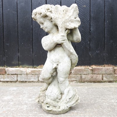 Lot 335 - A cast stone cherub