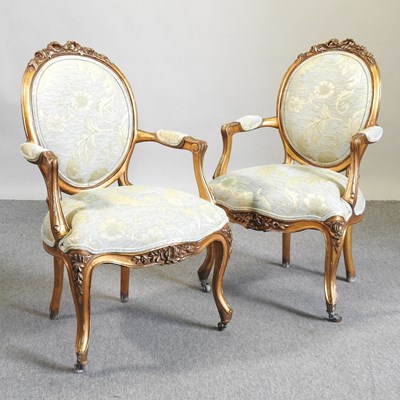 Lot 608 - A pair of gilt framed armchairs