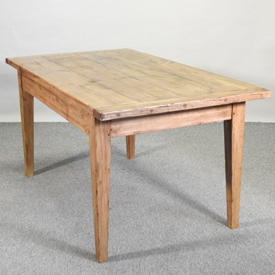 Lot 82 - A large modern pine dining table