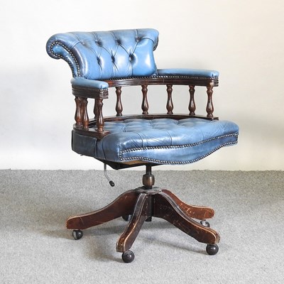Lot 647 - A blue leather desk chair