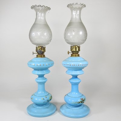 Lot 60 - A pair of blue glass oil lamps