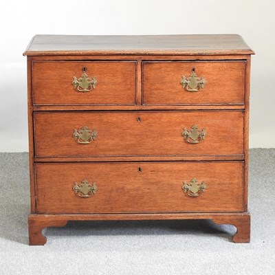 Lot 564 - A George III oak chest