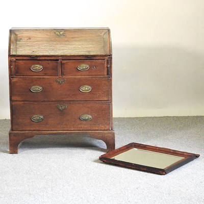 Lot 669 - A George III oak bureau