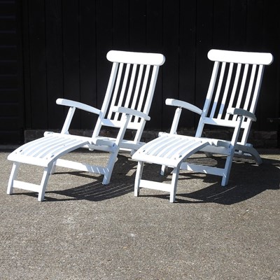 Lot 303 - A pair of garden loungers