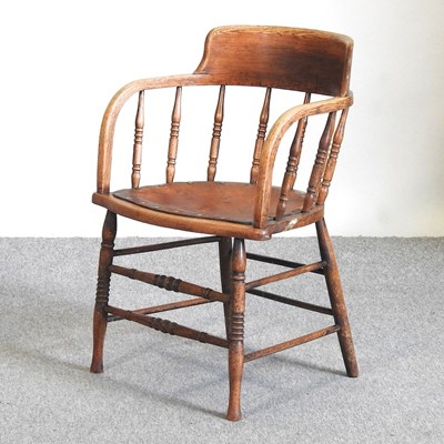 Lot 577 - An oak desk chair