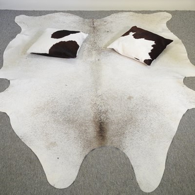 Lot 741 - A cow hide rug