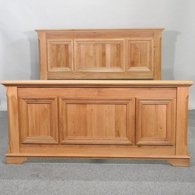 Lot 702 - A modern light oak bedstead