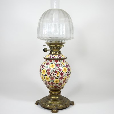 Lot 145 - A painted and brass oil lamp