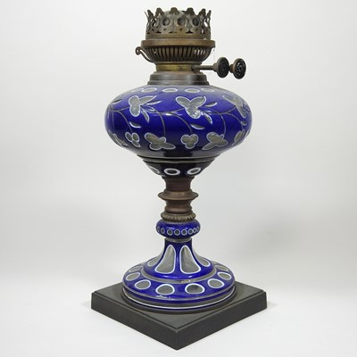 Lot 22 - A Bohemian overlaid blue glass oil lamp base
